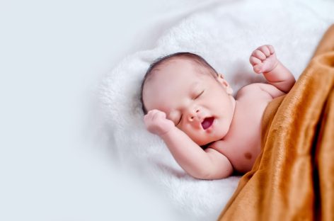 Why do some newborns develop jaundice?